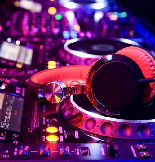 Dj mixer with headphones at nightclub